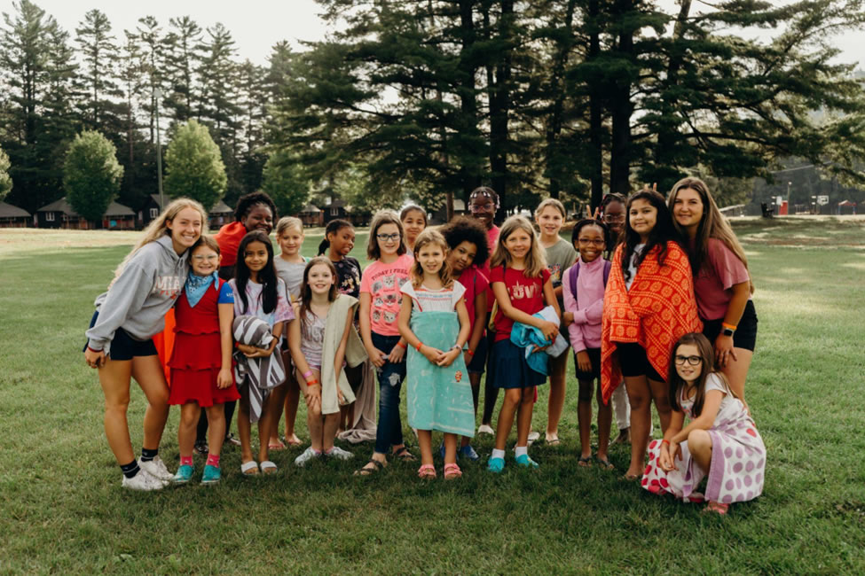 Several teens posing for camp group picture