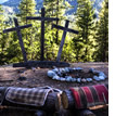 Campfire with three crosses in the background